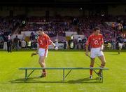 30 May 2004; Cork's Ronan Curran and Sean Og O'hAilpin, right, make their way to the bench for the team photograph. Guinness Munster Senior Hurling Championship Semi-Final, Limerick v Cork, Gaelic Grounds, Limerick. Picture credit; Ray McManus / SPORTSFILE