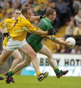 30 May 2004; Stephen McDermott, Donegal, in action against Joseph Quinn, Antrim. Bank of Ireland Ulster Senior Football Championship, Donegal v Antrim, McCool Park, Ballybofey, Co. Donegal. Picture credit; Damien Eagers / SPORTSFILE