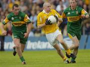 30 May 2004; Kevin McGourty, Antrim, in action against Barry Monaghan, left and Stephen McDermott, Donegal. Bank of Ireland Ulster Senior Football Championship, Donegal v Antrim, McCool Park, Ballybofey, Co. Donegal. Picture credit; Damien Eagers / SPORTSFILE