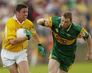 30 May 2004; Gearoid Adams, Antrim, in action against Stephen McDermott, Donegal. Bank of Ireland Ulster Senior Football Championship, Donegal v Antrim, McCool Park, Ballybofey, Co. Donegal. Picture credit; Damien Eagers / SPORTSFILE