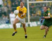 30 May 2004; Joseph Quinn, Antrim, in action against Adrian Sweeney, Donegal. Bank of Ireland Ulster Senior Football Championship, Donegal v Antrim, McCool Park, Ballybofey, Co. Donegal. Picture credit; Damien Eagers / SPORTSFILE