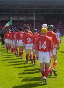 30 May 2004; The Cork team follow the band on the pre-match parade. Guinness Munster Senior Hurling Championship Semi-Final, Limerick v Cork, Gaelic Grounds, Limerick. Picture credit; Ray McManus / SPORTSFILE