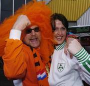 5 June 2004; Republic of Ireland supporter Brona Harte, Armagh, cheers on her team with a Dutch supporter before the start of the game. International Friendly, Holland v Republic of Ireland, Amsterdam Arena, Amsterdam, Holland. Picture credit; David Maher / SPORTSFILE