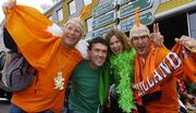 5 June 2004; Republic of Ireland supporters Tony Bowers and Joanne Hunt, Limerick, cheer on their team with Dutch supporters Pascal Hralt and Sander Postma before the game. International Friendly, Holland v Republic of Ireland, Amsterdam Arena, Amsterdam, Holland. Picture credit; David Maher / SPORTSFILE
