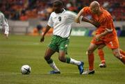 5 June 2004; Clinton Morrison, Republic of Ireland, in action against Jaap Stam, Holland. International Friendly, Holland v Republic of Ireland, Amsterdam Arena, Amsterdam, Holland. Picture credit; David Maher / SPORTSFILE