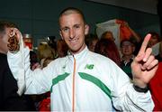 16 August 2013; Ireland's Robert Heffernan with his men's 50k walk gold medal in Dublin airport on his return from the IAAF World Athletics Championships in Moscow. Dublin Airport, Dublin. Photo by Sportsfile