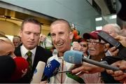 16 August 2013; Men's 50km gold medal winner Robert Heffernan in Dublin airport on his return from the IAAF World Athletics Championships in Moscow. Dublin Airport, Dublin. Picture credit: Brian Lawless / SPORTSFILE