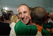 16 August 2013; Men's 50km gold medal winner Robert Heffernan is congratulated by a supporter in Dublin airport on his return from the IAAF World Athletics Championships in Moscow. Dublin Airport, Dublin. Picture credit: Brian Lawless / SPORTSFILE