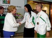16 August 2013; Men's 50km gold medal winner Robert Heffernan and his wife Marian after greeted by Minister for Children and Youth Affairs, Frances Fitzgerald T.D. on their return from the IAAF World Athletics Championships in Moscow. Dublin Airport, Dublin. Picture credit: Brian Lawless / SPORTSFILE