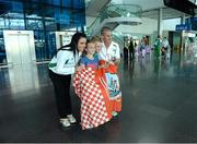 16 August 2013; Men's 50k walk gold medal winner Robert Heffernan with his wife Marian and children Cathal, age 8, and Meghan, age 10, in Dublin airport on his return from the IAAF World Athletics Championships in Moscow. Dublin Airport, Dublin. Picture credit: Brian Lawless / SPORTSFILE