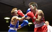 16 August 2013; Eric Donovan, Athy Boxing Club, left, exchanges punches with Declan Geraghty, Crumlin Boxing Club, during their 60kg bout. IABA Elite Boxing Competition, National Stadium, Dublin. Photo by Sportsfile