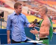 14 August 2013; Ireland's Robert Heffernan is interviewed after winning the men's 50k walk event, in a time of 3:37.56. IAAF World Athletics Championships - Day 5. Luzhniki Stadium, Moscow, Russia. Picture credit: Stephen McCarthy / SPORTSFILE