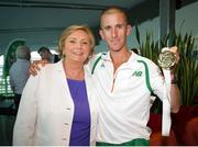 16 August 2013; Men's 50km gold medal winner Robert Heffernan and  Minister for Children and Youth Affairs, Frances Fitzgerald T.D., in Dublin airport on his return from the IAAF World Athletics Championships in Moscow. Dublin Airport, Dublin. Picture credit: Tomás Greally