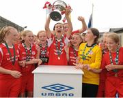 17 August 2013; Alex Kavanagh, Shelbourne, lifts the cup. FAI Umbro U14 Women's Cup Final, Peamount United v Shelbourne, Oscar Traynor Centre, Coolock, Dublin. Picture credit: Pat Murphy / SPORTSFILE