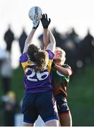 27 November 2022; Grainne Horan of Mullinahone in action against Lynne Carroll of Derrygonnelly Harps during the CurrentAccount.ie LGFA All-Ireland Intermediate Club Championship Semi-Final match between Mullinahone, Tipperary, and Derrygonnelly, Fermanagh, at John Locke Park in Callan, Kilkenny. Photo by David Fitzgerald/Sportsfile