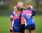 27 November 2022; Naomh Abán manager Noel McDonagh celebrates with Grace Murphy and Amy McDonagh after the 2022 CurrentAccount.ie All-Ireland Ladies Junior Club Football Championship semi-final between Naomh Abán, Cork, and Castleblayney Faughs, Monaghan, at Páirc Íosagáin, Naomh Abán, Co. Cork. Photo by Cian O’Regan/Sportsfile