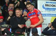 27 November 2022; Mark Caulfield of St. Thomas receives the player of the match trophy from Liam Brady after the Galway County Senior Hurling Championship Final Replay match between St Thomas and Loughrea at Pearse Stadium in Galway. Photo by Ray Ryan/Sportsfile