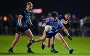 30 November 2022; Ben O'Carroll of UCD in action against Colin Walsh of Maynooth University during the Electric Ireland Higher Education Senior Football Division 1 League Final match between UCD and Maynooth University at the Dublin City University Sports Campus in Dublin. Photo by Seb Daly/Sportsfile