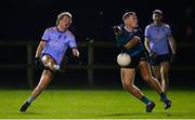 30 November 2022; Fiachra Clifford of UCD in action against Colin Walsh of Maynooth University during the Electric Ireland Higher Education Senior Football Division 1 League Final match between UCD and Maynooth University at the Dublin City University Sports Campus in Dublin. Photo by Seb Daly/Sportsfile