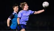 30 November 2022; Fiachra Clifford of UCD in action against Colm Harnett of Maynooth University during the Electric Ireland Higher Education Senior Football Division 1 League Final match between UCD and Maynooth University at the Dublin City University Sports Campus in Dublin. Photo by Seb Daly/Sportsfile
