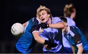 30 November 2022; Fiachra Clifford of UCD in action against Darragh Lyons, left, and Colm Harnett of Maynooth University during the Electric Ireland Higher Education Senior Football Division 1 League Final match between UCD and Maynooth University at the Dublin City University Sports Campus in Dublin. Photo by Seb Daly/Sportsfile