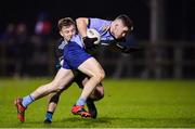 30 November 2022; Davy Garland of UCD in action against Aaron Brazil of Maynooth University during the Electric Ireland Higher Education Senior Football Division 1 League Final match between UCD and Maynooth University at the Dublin City University Sports Campus in Dublin. Photo by Seb Daly/Sportsfile