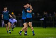 30 November 2022;  Darragh Warnock of Maynooth University celebrates with teammate John Lawlor after their side's victory in the Electric Ireland Higher Education Senior Football Division 1 League Final match between UCD and Maynooth University at the Dublin City University Sports Campus in Dublin. Photo by Seb Daly/Sportsfile