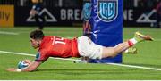 2 December 2022; Calvin Nash of Munster scores his side's third try during the United Rugby Championship match between Edinburgh and Munster at the Dam Heath Stadium in Edinburgh, Scotland. Photo by Paul Devlin/Sportsfile