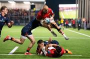 2 December 2022; Simon Zebo of Munster is tackled by James Lang of Edinburgh during the United Rugby Championship match between Edinburgh and Munster at the Dam Heath Stadium in Edinburgh, Scotland. Photo by Paul Devlin/Sportsfile