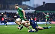 3 December 2022; Niall Murray of Connacht on his way to scoring his side's first try despite the tackle of Marcus Watson of Benetton during the United Rugby Championship match between Connacht and Benetton at The Sportsground in Galway. Photo by Ben McShane/Sportsfile