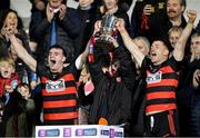 3 December 2022; Ballygunner joint captains Dessie Hutchinson, left, and Ian Kenny lift the cup with supporter Tom Mullane after the AIB Munster GAA Hurling Senior Club Championship Final match between Ballygunner of Waterford and Ballyea of Clare at FBD Semple Stadium in Thurles, Tipperary. Photo by Ray McManus/Sportsfile