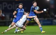 3 December 2022; Hugo Keenan of Leinster is tackled by Michael Lowry of Ulster during the United Rugby Championship match between Leinster and Ulster at the RDS Arena in Dublin. Photo by Ramsey Cardy/Sportsfile