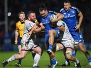 3 December 2022; James Lowe of Leinster is tackled by Andrew Warwick, left, and Alan O'Connor of Ulster during the United Rugby Championship match between Leinster and Ulster at the RDS Arena in Dublin. Photo by Ramsey Cardy/Sportsfile