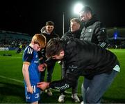 3 December 2022; Matchday mascot Gus Morrissey, age eight, has his jersey signed by Brian Deeny of Leinster at the United Rugby Championship match between Leinster and Ulster at the RDS Arena in Dublin. Photo by Harry Murphy/Sportsfile