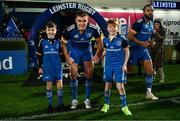 3 December 2022; Leinster captain Garry Ringrose with matchday mascots Gus Morrissey, age eight, left, and   Andrew McNally, age 10, at the United Rugby Championship match between Leinster and Ulster at the RDS Arena in Dublin. Photo by Harry Murphy/Sportsfile