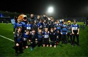 3 December 2022; The Wexford RFC team with Leo the Lion and Leinster players, from left, Will Connors, James Tracy, Brian Deeny and Cormac Foley before the Bank of Ireland Half-time Minis at the United Rugby Championship match between Leinster and Ulster at the RDS Arena in Dublin. Photo by Harry Murphy/Sportsfile