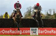 4 December 2022; Malina Girl, right, with Luke Dempsey up, jumps the last on their way to winning the Bar One Racing Irish EBF Mares Handicap Steeplechase, from second place Optional Mix, left, with Jordan Gainford up, at Fairyhouse Racecourse in Ratoath, Meath. Photo by Seb Daly/Sportsfile