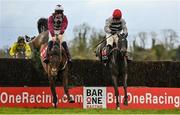 4 December 2022; Malina Girl, right, with Luke Dempsey up, jumps the last on their way to winning the Bar One Racing Irish EBF Mares Handicap Steeplechase, from second place Optional Mix, left, with Jordan Gainford up, at Fairyhouse Racecourse in Ratoath, Meath. Photo by Seb Daly/Sportsfile