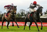 4 December 2022; Malina Girl, right, with Luke Dempsey up, on their way to winning the Bar One Racing Irish EBF Mares Handicap Steeplechase, from second place Optional Mix, left, with Jordan Gainford up, at Fairyhouse Racecourse in Ratoath, Meath. Photo by Seb Daly/Sportsfile