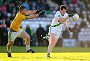 4 December 2022; Aidan Claffey of Moycullen in action against Adrian McIntyre of Tourlestrane during the AIB Connacht GAA Football Senior Club Championship Final match between Moycullen of Galway and Tourlestrane of Mayo at Pearse Stadium in Galway. Photo by Ben McShane/Sportsfile