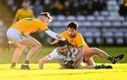 4 December 2022; Eoghan Kelly of Moycullen is tackled by Liam Gaughan, left, and John Kelly of Tourlestrane during the AIB Connacht GAA Football Senior Club Championship Final match between Moycullen of Galway and Tourlestrane of Mayo at Pearse Stadium in Galway. Photo by Ben McShane/Sportsfile