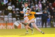 4 December 2022; Liam Gaughan of Tourlestrane kicks a point under pressure from Neil Mulcahy of Moycullen during the AIB Connacht GAA Football Senior Club Championship Final match between Moycullen of Galway and Tourlestrane of Mayo at Pearse Stadium in Galway. Photo by Ben McShane/Sportsfile