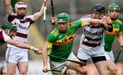 4 December 2022; Kevin Molloy of Dunloy Cuchullains is tackled by Brian Cassidy, left, and Brendan Rogers of Slaughtneil during the AIB Ulster GAA Hurling Senior Club Championship Final match between Dunloy Cuchullains of Antrim and Slaughtneil of Derry at Athletics Grounds in Armagh. Photo by Ramsey Cardy/Sportsfile