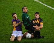4 December 2022; Referee Maurice Deegan is accidentally knocked to the ground as Aidan Jones of Kilmacud Crokes and Kevin O’Sullivan of The Downs contest possession, during Deegan's last game to referee at Croke Park, during the AIB Leinster GAA Football Senior Club Championship Final match between Kilmacud Crokes of Dublin and The Downs of Westmeath at Croke Park in Dublin. Photo by Piaras Ó Mídheach/Sportsfile