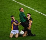 4 December 2022; Referee Maurice Deegan is accidentally knocked to the ground as Aidan Jones of Kilmacud Crokes and Kevin O’Sullivan of The Downs contest possession, during Deegan's last game to referee at Croke Park, during the AIB Leinster GAA Football Senior Club Championship Final match between Kilmacud Crokes of Dublin and The Downs of Westmeath at Croke Park in Dublin. Photo by Piaras Ó Mídheach/Sportsfile