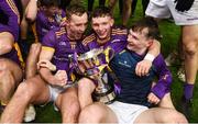 4 December 2022; Kilmacud Crokes players, left to right, Shane Cunningham, Padraic Purcell and Michael Mullin celebrate after the AIB Leinster GAA Football Senior Club Championship Final match between Kilmacud Crokes of Dublin and The Downs of Westmeath at Croke Park in Dublin. Photo by Daire Brennan/Sportsfile