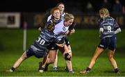 7 December 2022; Clodagh Farrell of Midlands is tackled by Charlotte Nagle, left, and Isobel O’Sullivan of Metro during the Bank of Ireland Leinster Rugby Sarah Robinson Cup Round 3 match between Metro and Midlands at Coolmine RFC in Dublin. Photo by Seb Daly/Sportsfile