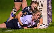 7 December 2022; Clodagh Farrell of Midlands scores her side's second try, despite the tackle of Metro's Brooke Fagan Merrigan, during the Bank of Ireland Leinster Rugby Sarah Robinson Cup Round 3 match between Metro and Midlands at Coolmine RFC in Dublin. Photo by Seb Daly/Sportsfile