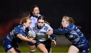7 December 2022; Sorcha Ryan of Midlands is tackled by Sinead Farrell, left, and Charlotte Nagle of Metro during the Bank of Ireland Leinster Rugby Sarah Robinson Cup Round 3 match between Metro and Midlands at Coolmine RFC in Dublin. Photo by Seb Daly/Sportsfile