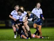 7 December 2022; Saoirse Guinan of Midlands is tackled by Emily Tarrant and Giselle O’Donoghue of Metro of Metro during the Bank of Ireland Leinster Rugby Sarah Robinson Cup Round 3 match between Metro and Midlands at Coolmine RFC in Dublin. Photo by Seb Daly/Sportsfile
